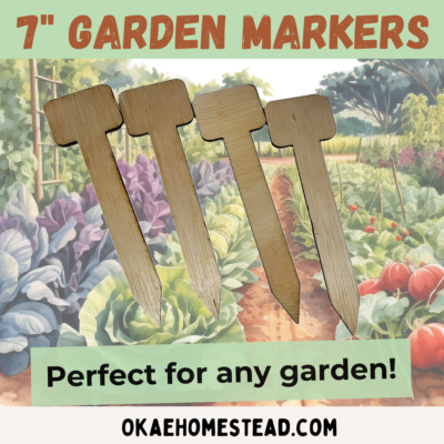 7" garden markers, perfect for any garden. Image of T shaped garden stakes with a vegetable garden background